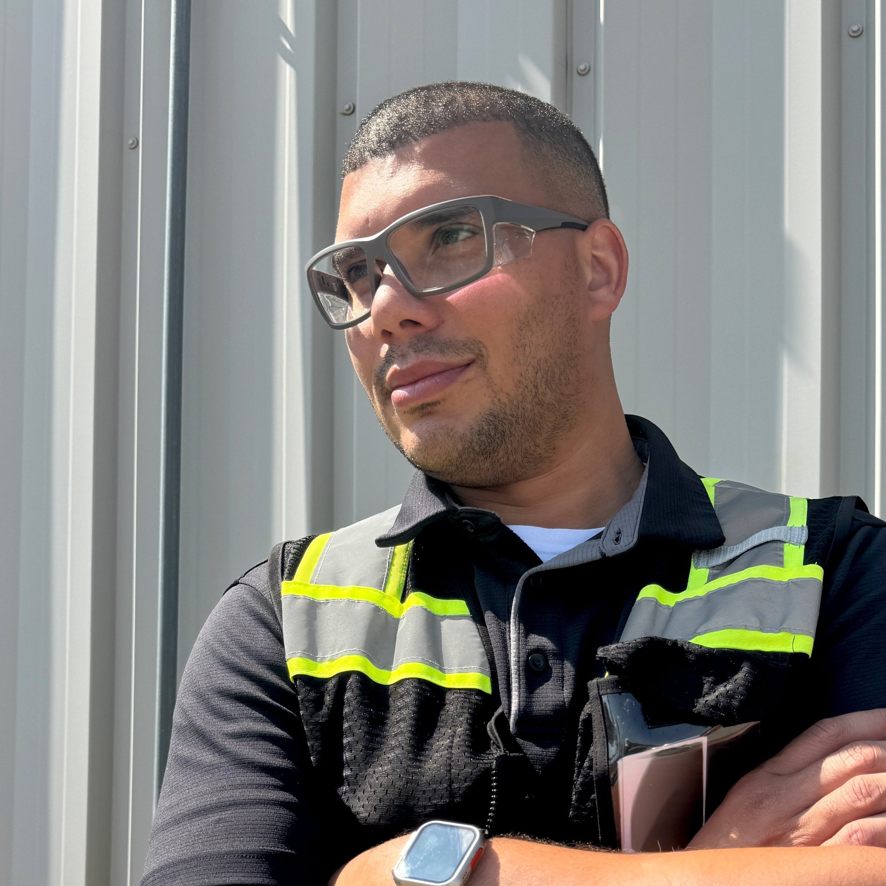 HiDX prescription safety glasses in Matte Black worn by worker outdoors