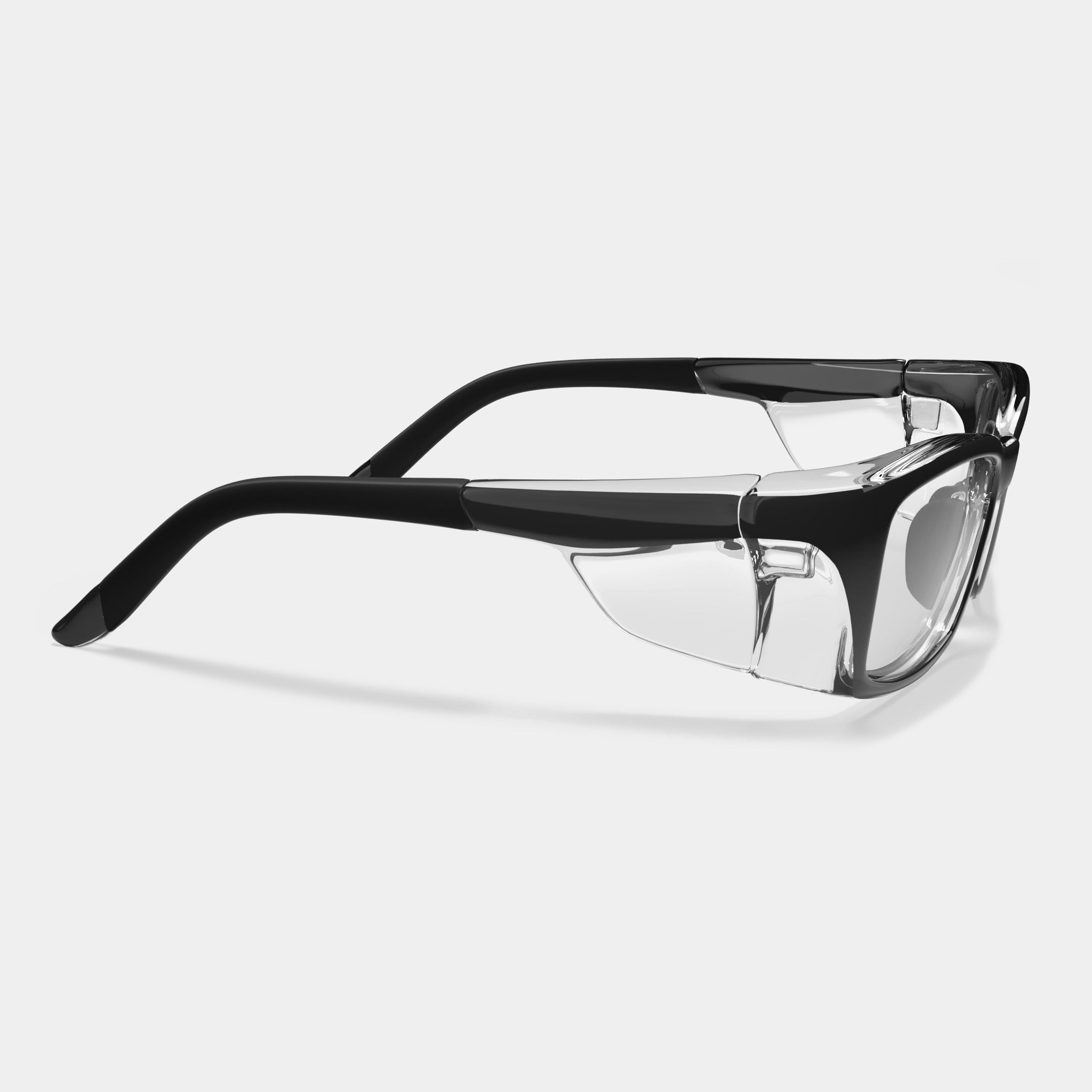 A007 prescription safety glasses in black clear with side shields on a white background